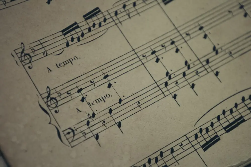 A sheet of music with musical notes on it, illustrating cultural continuity beyond music